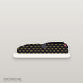 Zapatilla slip-on negra con patrón micro-corona dorado all-over y suela blanca